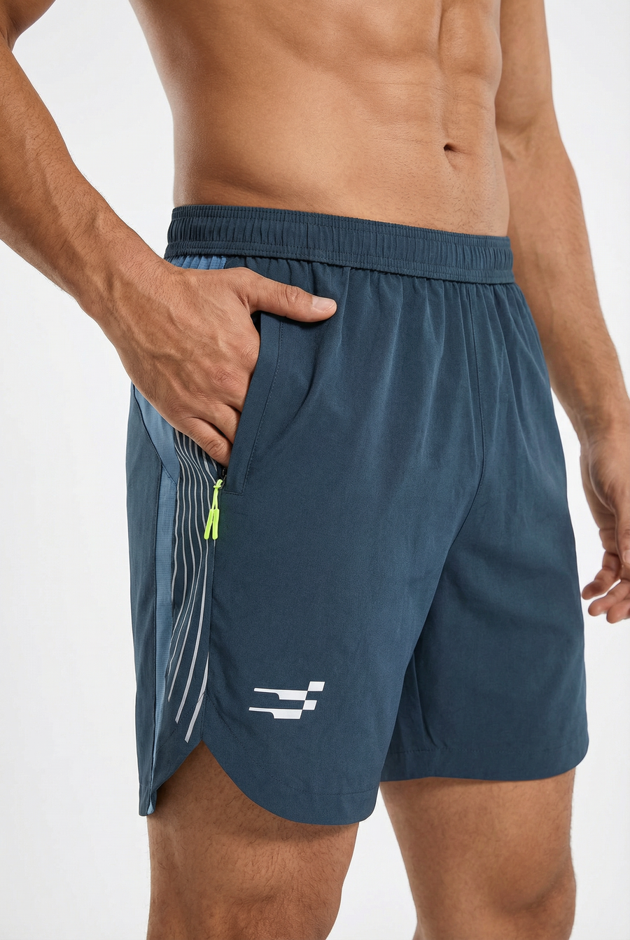 Apex Performance Shorts in dark teal, close-up of the zip pocket with lime pull and reflective side lines