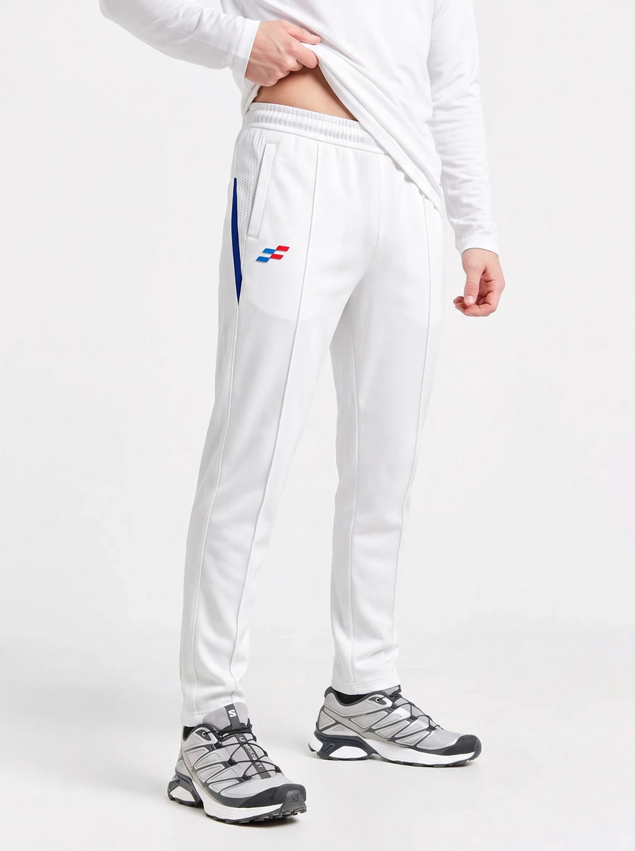 Bouncer Cricket Whites Trouser in off-white, full-length front view with navy side insert and mesh pocket panel