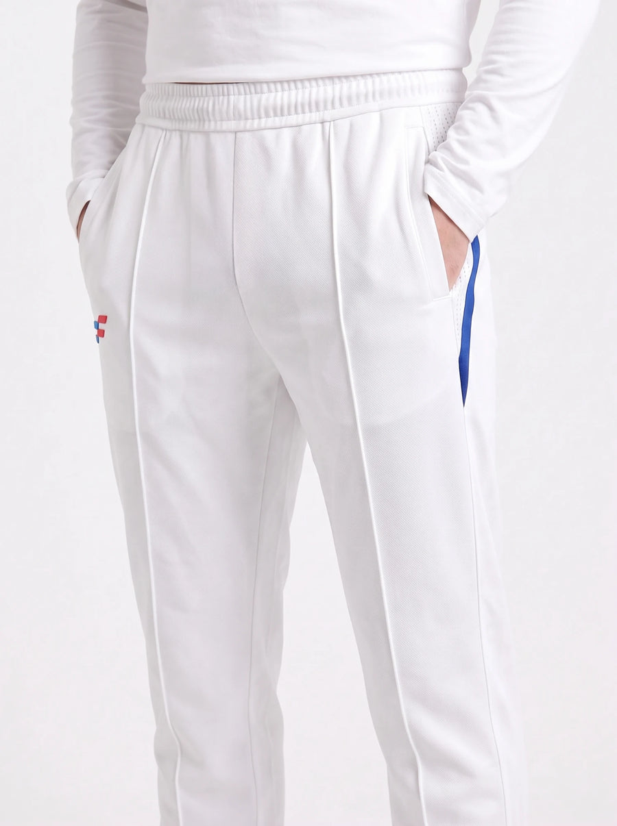Bouncer Cricket Whites Trouser front view, hands in pockets, showing elastic waistband and front piping