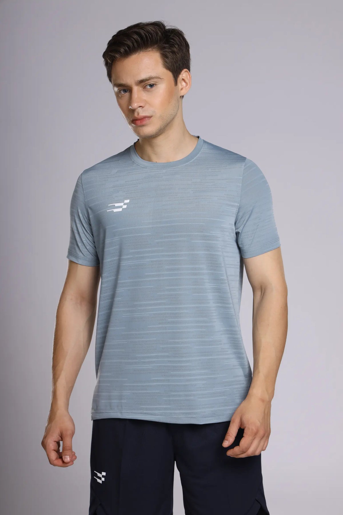 Fit-Gear Iron T-Shirt in steel grey, front view showing the linear knit texture and white chest logo