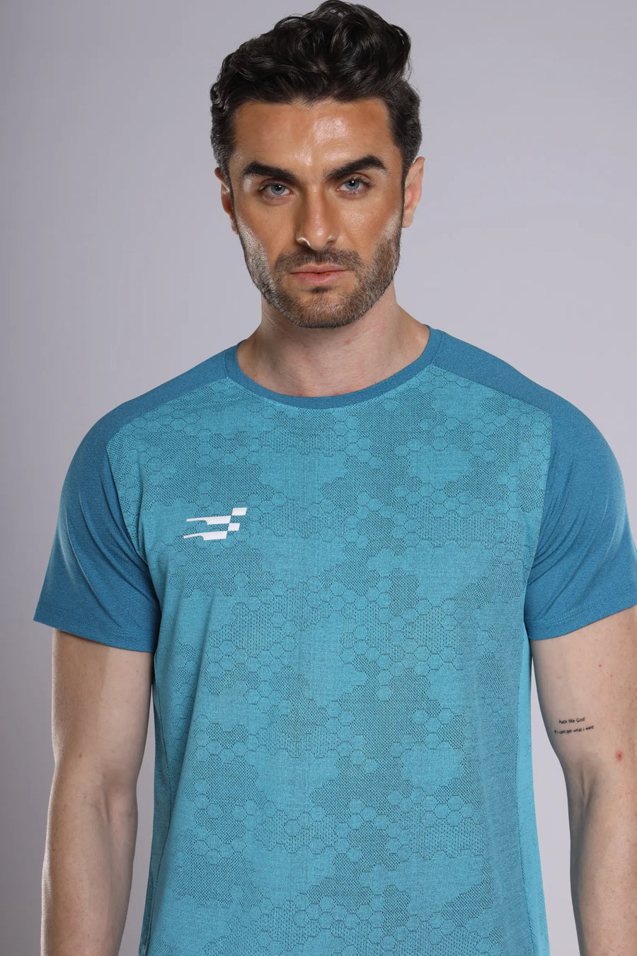 Fit-Gear Octagon T-Shirt in teal, close-up of the textured honeycomb-style chest pattern and logo