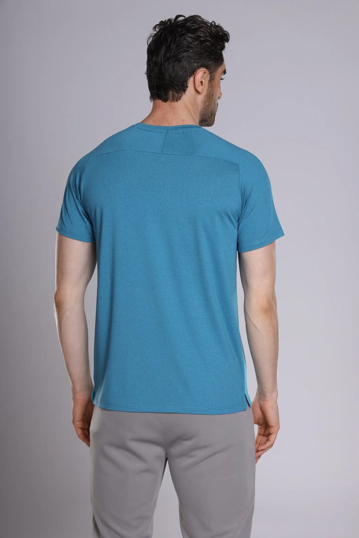 Fit-Gear Octagon T-Shirt in teal, back view on a model