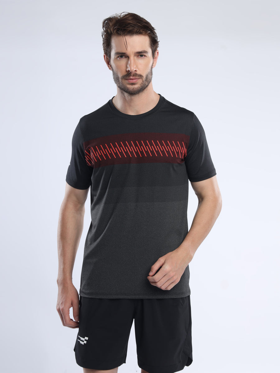 Fit-Gear Slam Running T-Shirt in black, front view on a model showing the red zigzag print across the chest