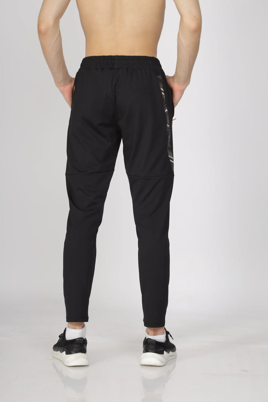 Max-Out Training Track Pant in black, back view on a model