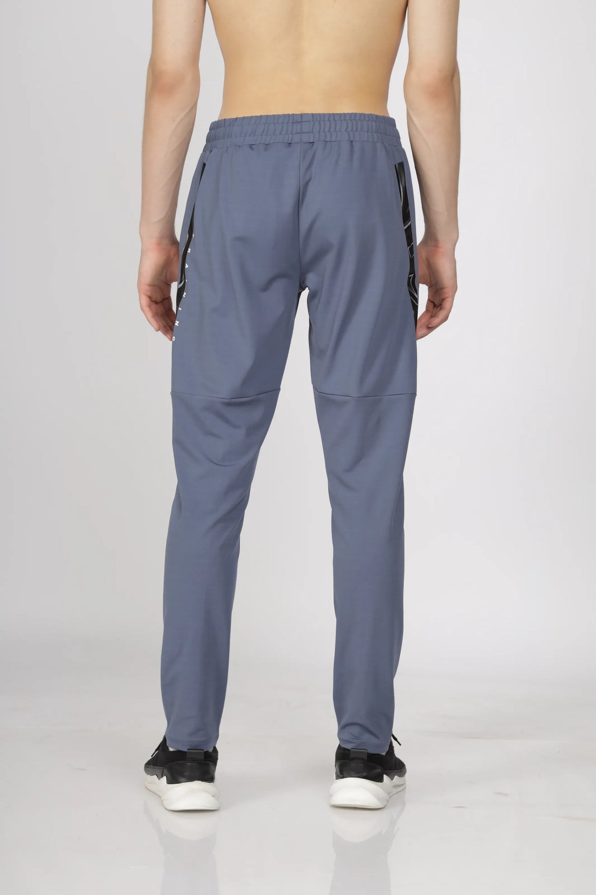 Max-Out Training Track Pant in grey, back view with panelled legs