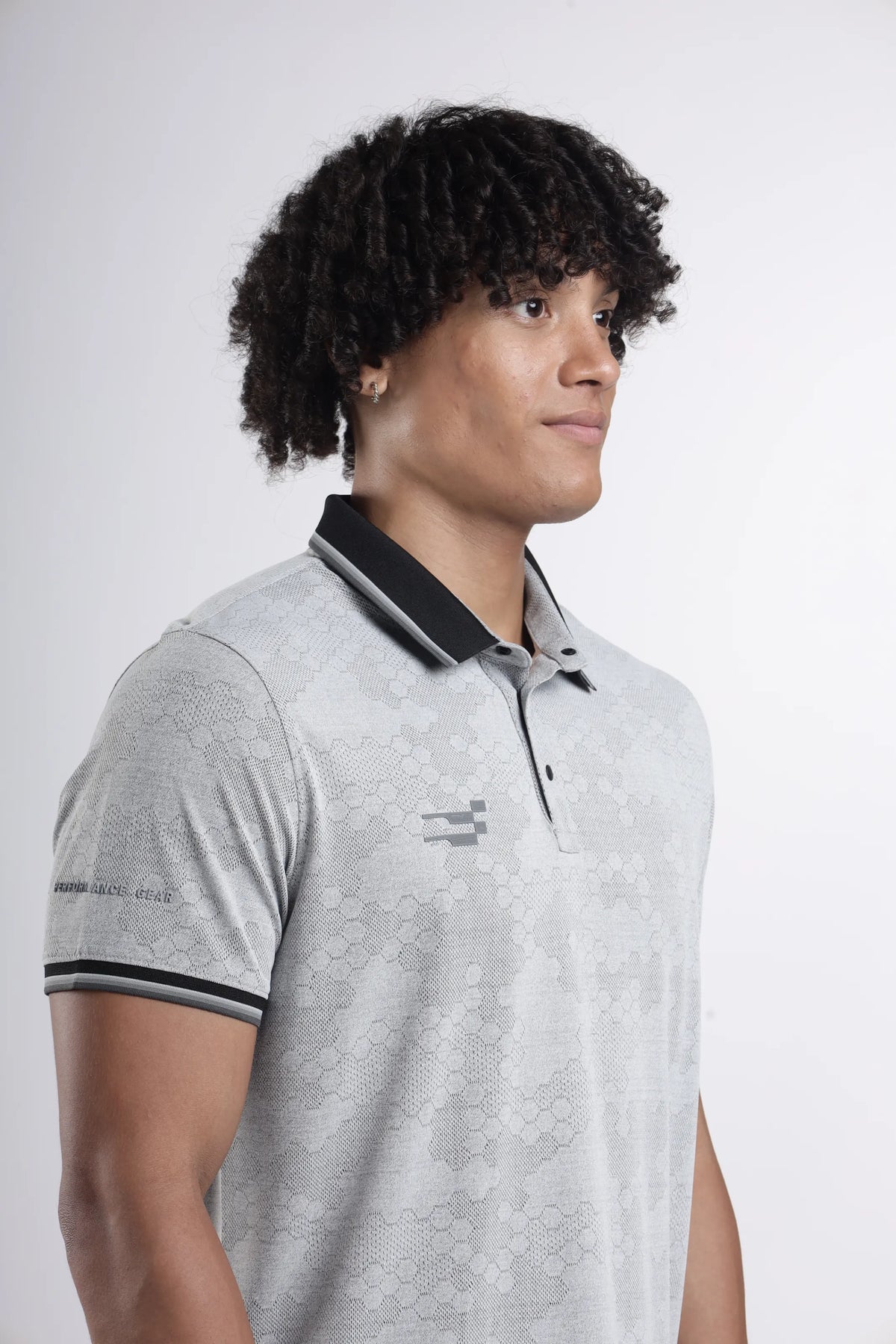 Octagon Performance Polo T-Shirt in light grey, close-up of the black collar, placket, striped sleeve cuff and pattern