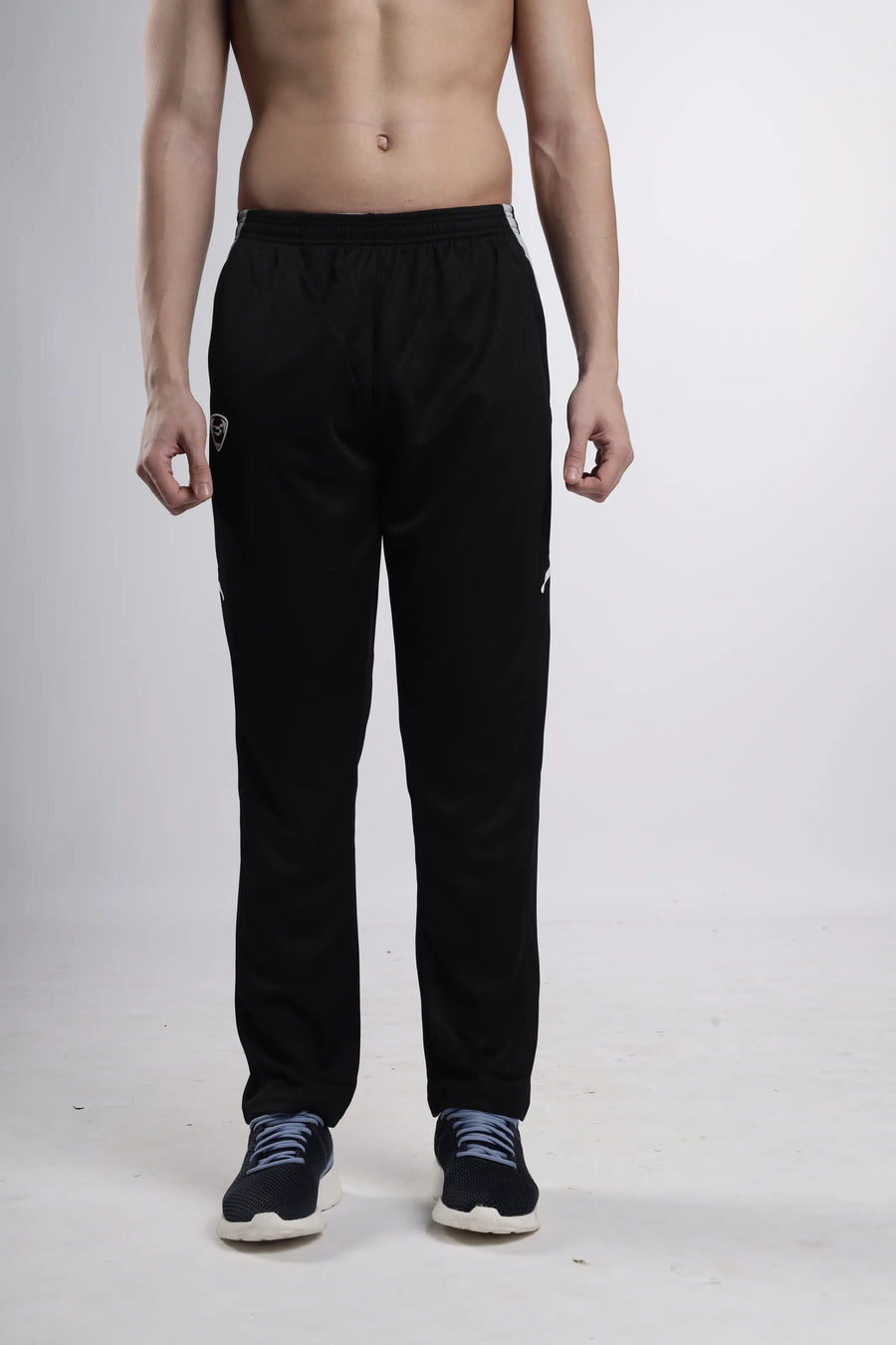 ProSwift Performance Track Pant in black, front view on a model with a straight leg
