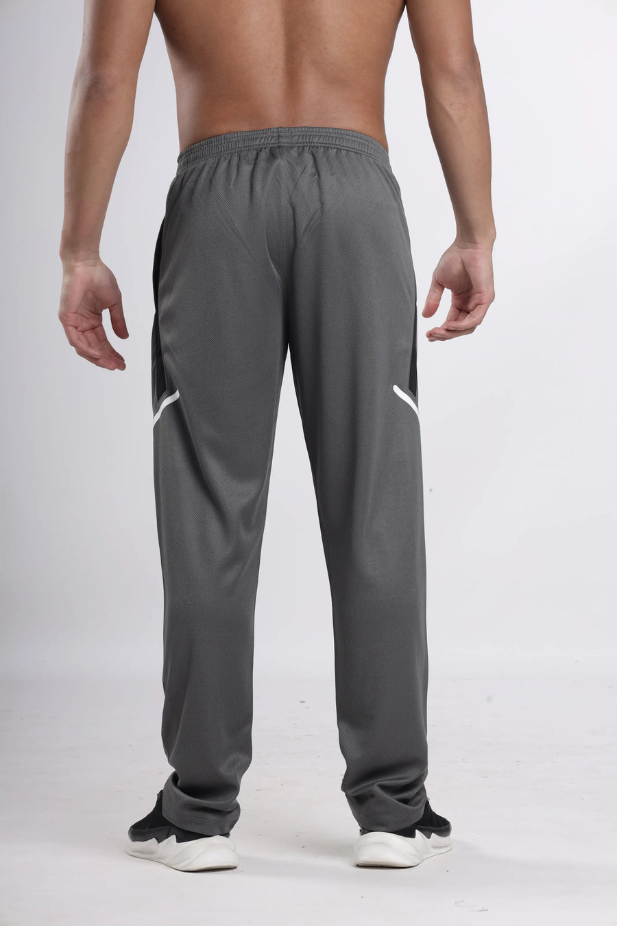 ProSwift Performance Track Pant in grey, back view on a model showing the white trim on the back panels