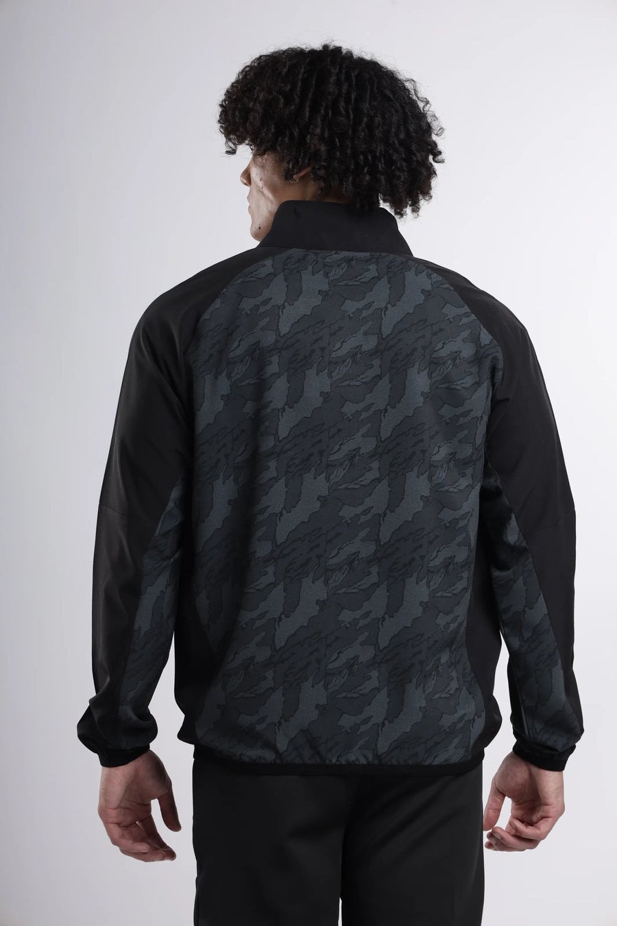 Quantum Performance Track-Top in black, back view with the grey camo print panel and black sleeves