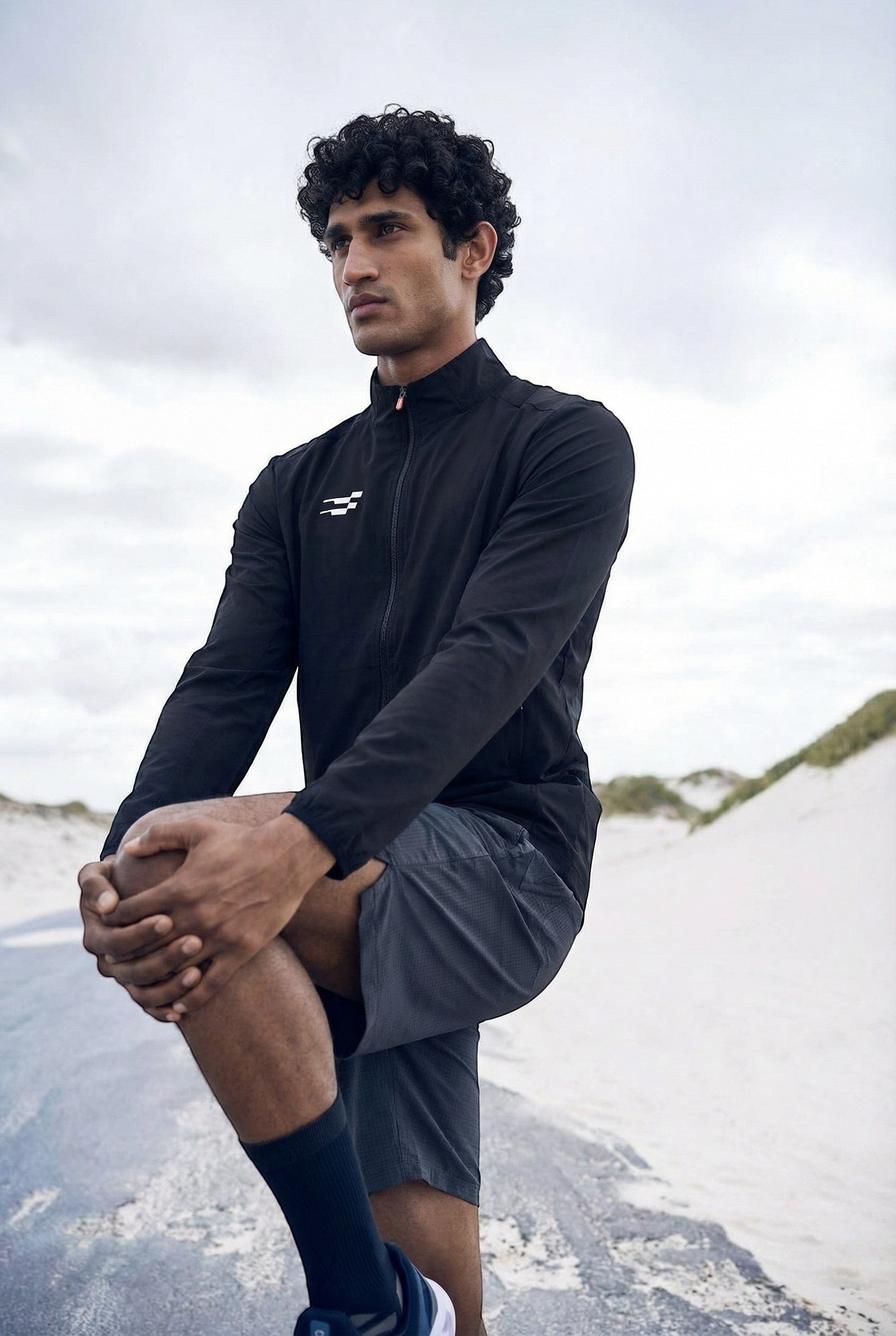 Sportiff black performance track top with woven shell and stretch fabric, designed for training and everyday wear.