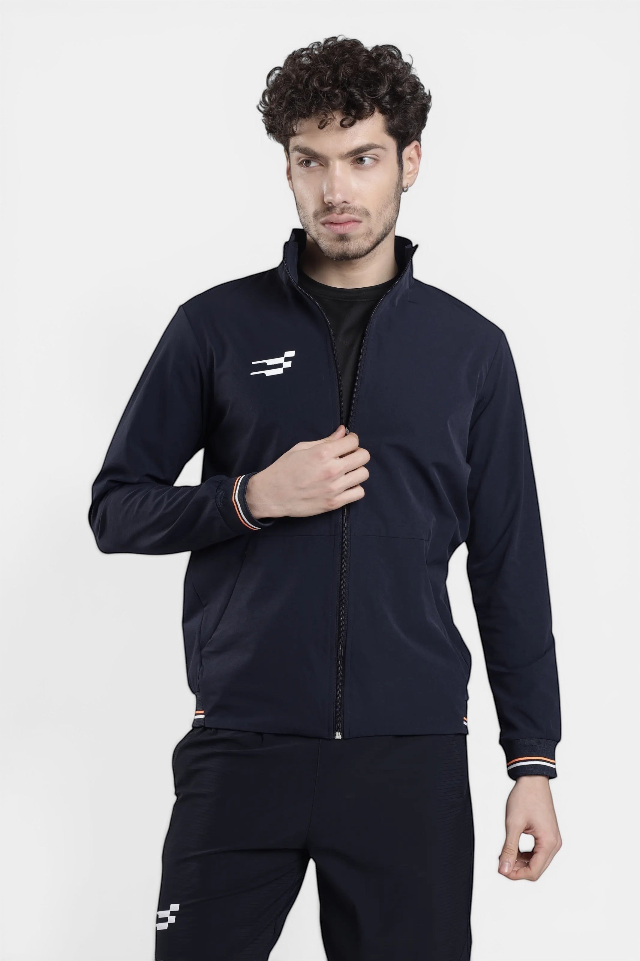 Sportiff navy blue woven shell and stretch performance track top with zip closure and striped cuffs.