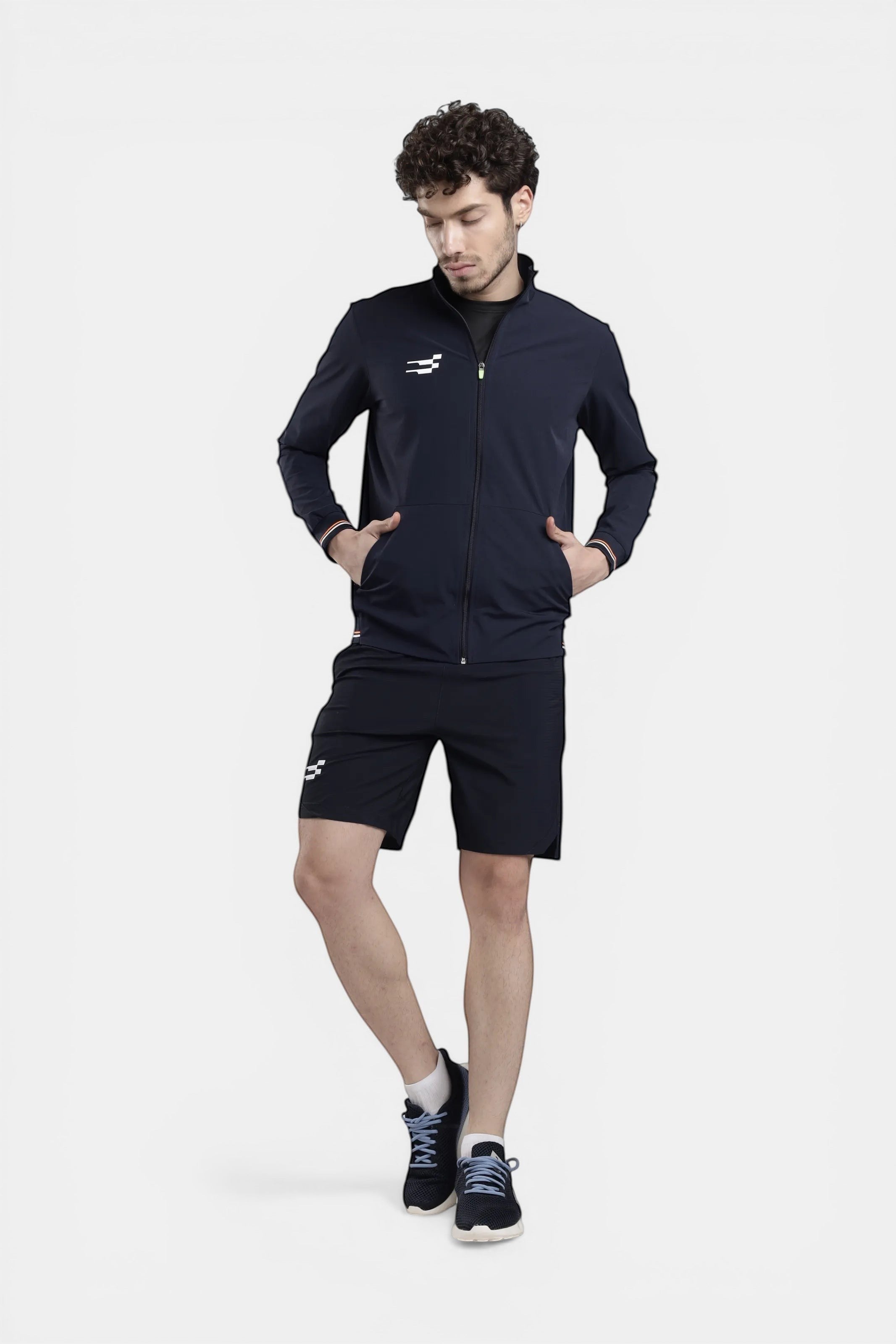 Sportiff navy blue performance track top with woven shell and stretch fabric, featuring a zip closure and athletic silhouette.
