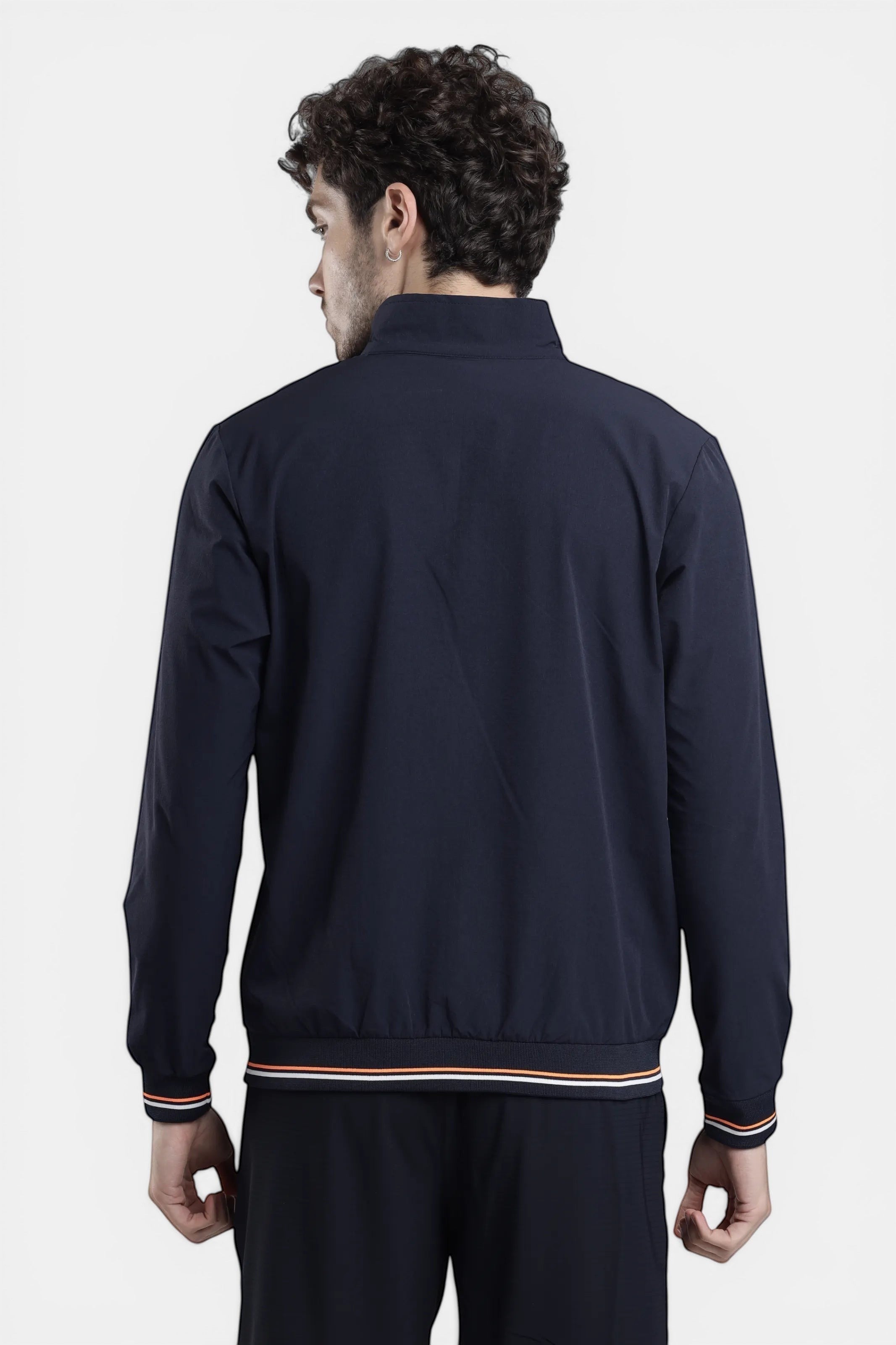 Sportiff navy blue woven shell track top with stretch fabric and striped cuffs, designed for performance and everyday wear.
