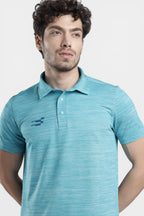 Sportiff Pulseline Performance Polo in scuba blue, featuring a textured jacquard knit fabric and a subtle chest logo. Designed for training and active wear.