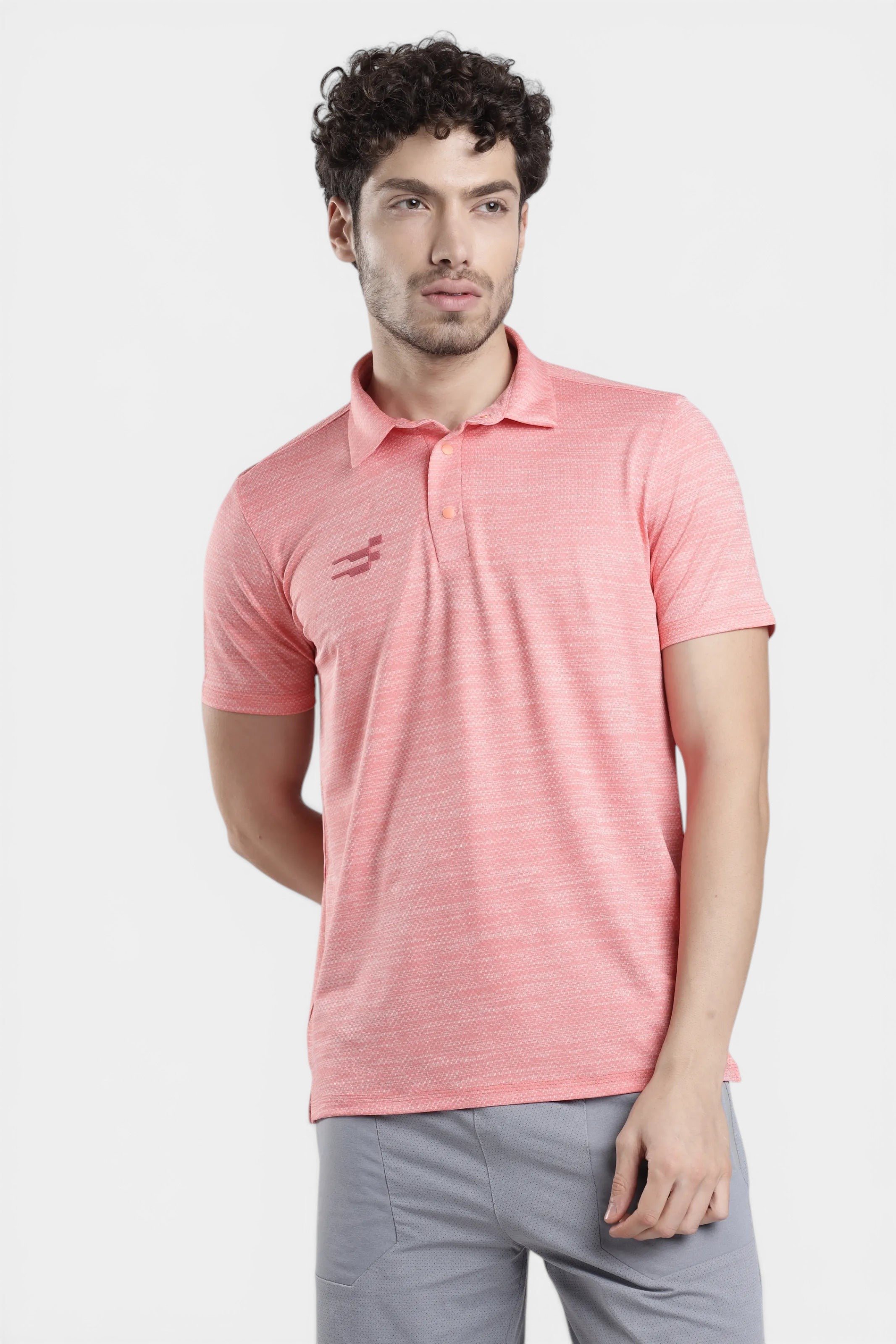 Man wearing salmon melange performance polo t-shirt for gym training