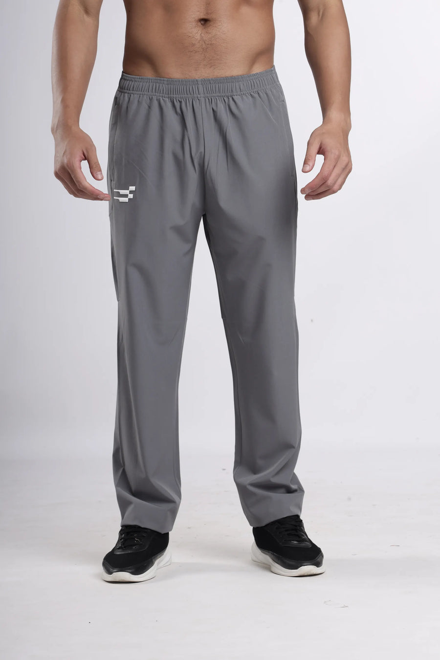 StrideX LightMotion Track Pant in grey, front view on a model showing the straight leg