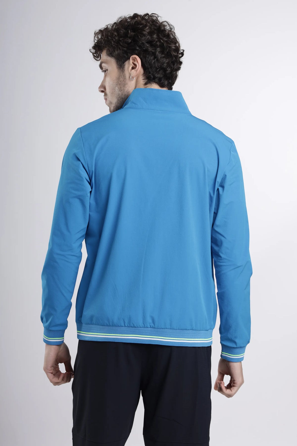 Tech-Shell Performance Track-Top in blue, back view showing the stand collar and lime-striped ribbed hem and cuffs