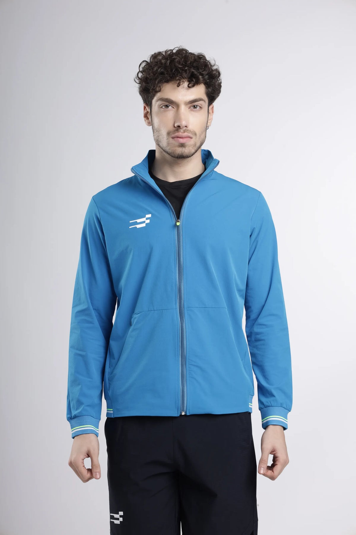 Tech-Shell Performance Track-Top in blue, front view of the zipped track top with striped cuffs and chest logo